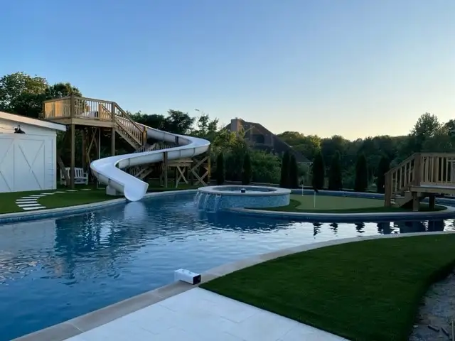 Pool waterslide built by Waterscapes Backyard Resorts in Middle Tennessee