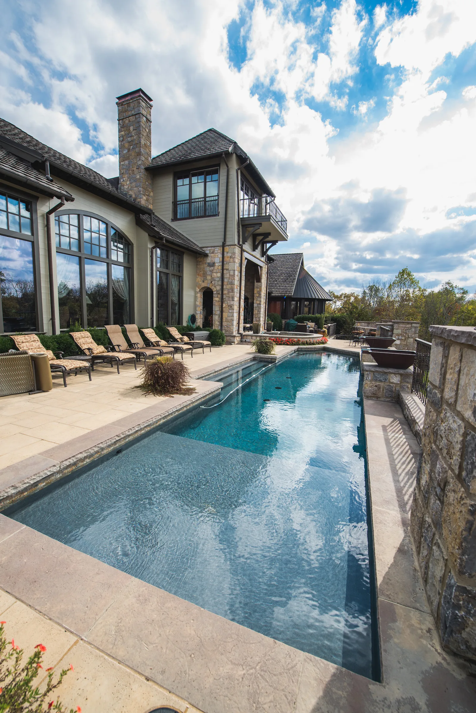 Custom pool with water features in a Franklin, Tennessee backyard